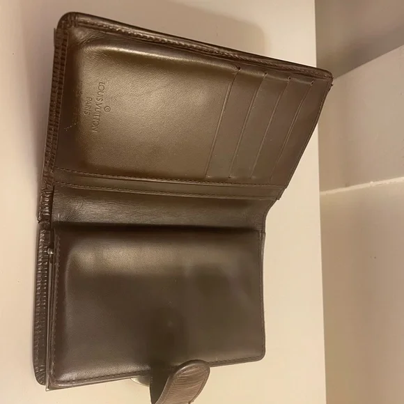Louis Vuitton wallet. Dark brown in good condition.